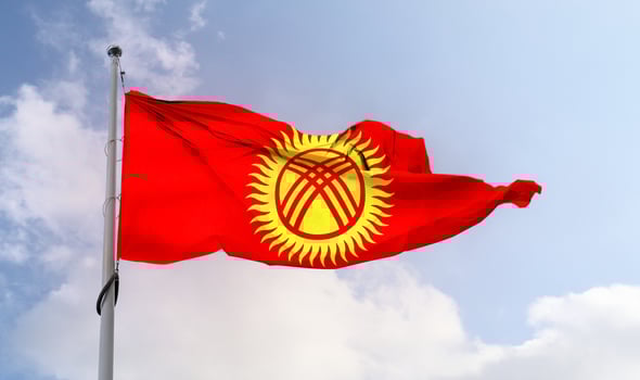 Kyrgyzstan flag - realistic waving fabric flag. photo