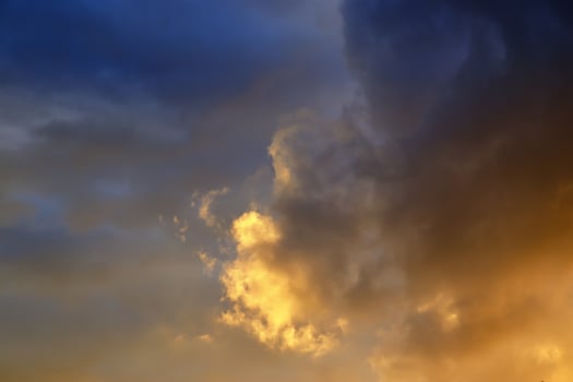Beautiful panorama of orange and yellow clouds at sunrise photo
