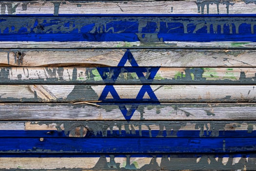 The national flag of Israel  is painted on uneven boards. Country symbol. photo