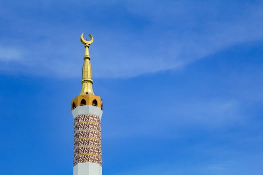 Islamic mosque tower crossing the sky photo