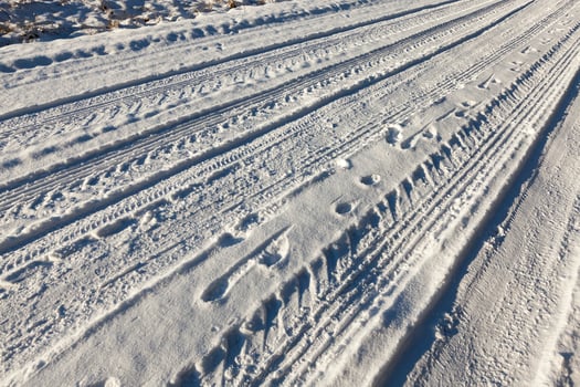 traces of the car on the road photo