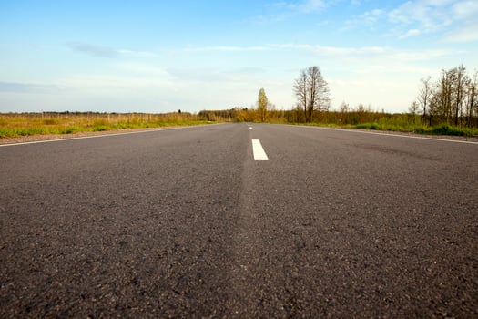 asphalt road and sky photo
