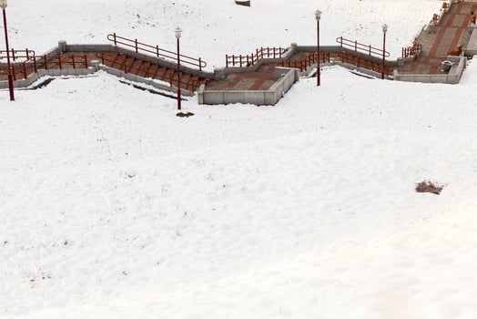 stone stairs snowfall photo