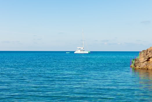Sailboat on blue ocean photo