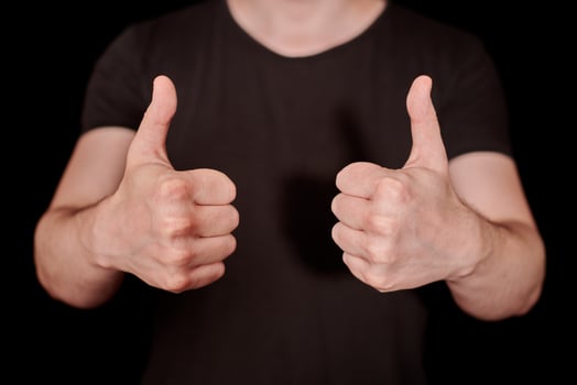 Thumbs up signal man hand gesture photo