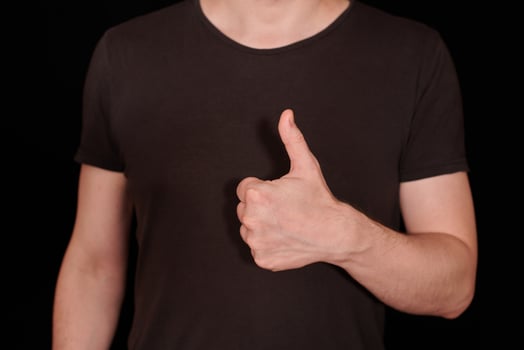 Thumbs up signal man hand gesture photo
