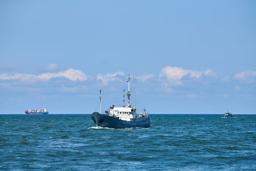 Survey vessel, research vessel patrol boat sailing in bright blue Baltic Sea, navy patrol vessel photo