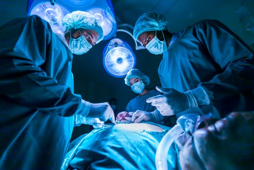 Team of surgeon doctors are performing heart surgery operation for patient from organ donor to save more life in emergency surgical room photo