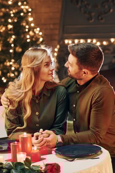 Conception of relationships. Young lovely couple have romantic dinner indoors together photo