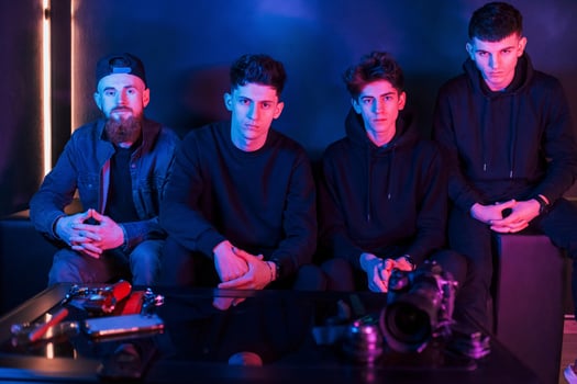 Group of people is together in the studio with futuristic neon lighting photo