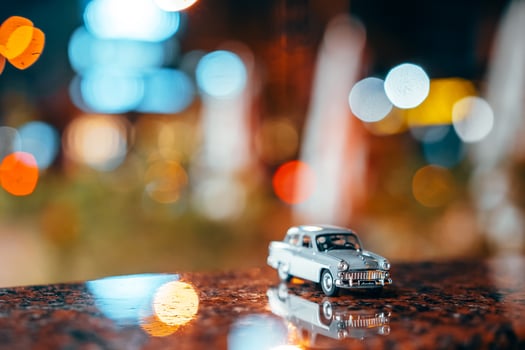 Moskvich 401 on the table, glowing background photo