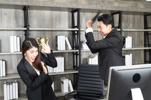 Emotional colleagues fighting in office. Workplace conflict. Angry boss. Man as a boss in the office is violent against a woman as an employee photo