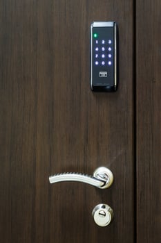 wooden door with electronic combination lock photo