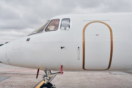 Cloudy weather. Turboprop aircraft parked on the runway at daytime photo
