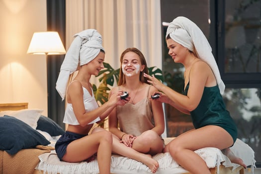 Home spa. Group of happy women that is at a bachelorette party photo