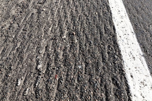 asphalt road that needs repaired photo