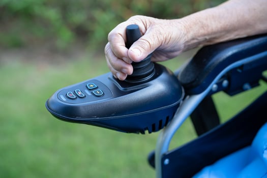 Asian senior or elderly old lady woman patient on electric wheelchair with remote control at nursing hospital ward, healthy strong medical concept photo