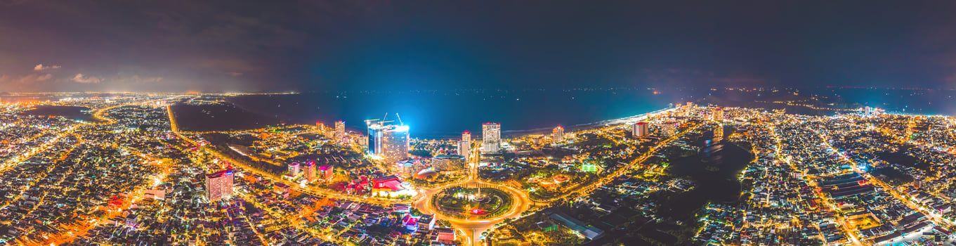 Vung Tau view from above, with traffic roundabout, house, Vietnam war memorial in Vietnam. Long exposure photography at night. photo