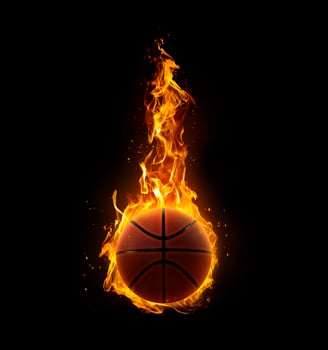 Basketball on fire on black background photo