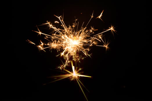 New year party sparkler on black background photo