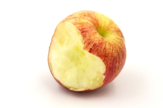 red apple with a heart shape from the bite on white background. photo
