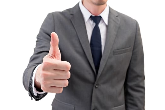 Businessman showing thumbs up isolated on white background. photo