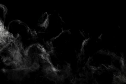 Abstract powder or smoke effect isolated on black background photo