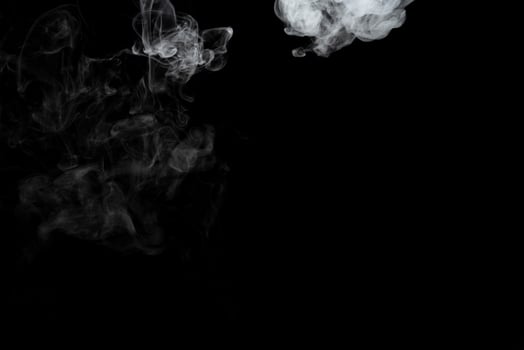 Abstract powder or smoke effect isolated on black background photo