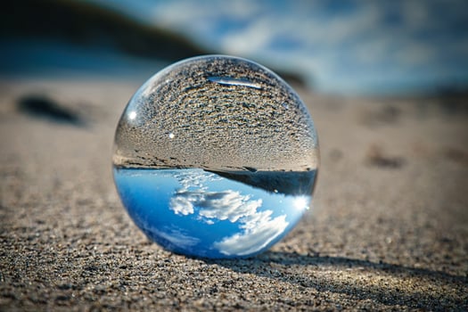 glass sphere on the beach of the baltic sea. photo