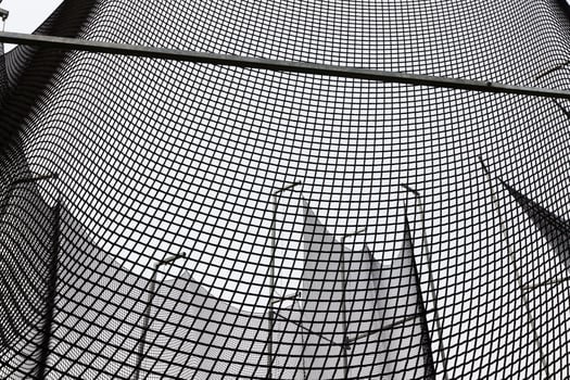 a thick strong net that restricts sports equipment photo