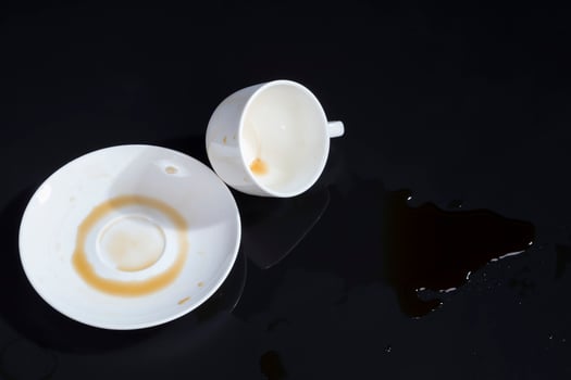 black aromatic coffee spilled due to carelessness photo