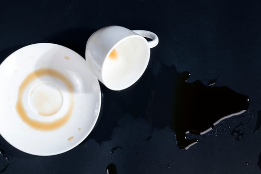 black aromatic coffee spilled due to carelessness photo