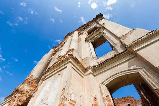 abandoned ruins of an ancient fortress made of red brick photo