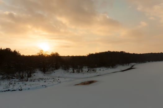 sunset with orange shades in the winter season photo