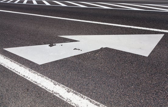 paved road with white road markings photo