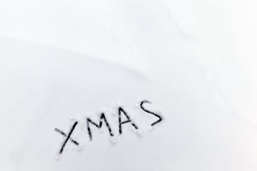 words xmas painted on snow photo