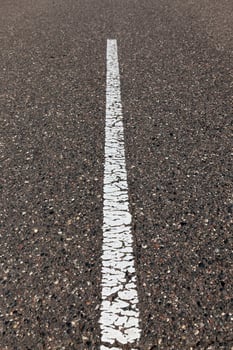 paved road with white road markings for transport management photo