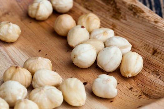 dried hazelnutsnuts on a wooden table photo