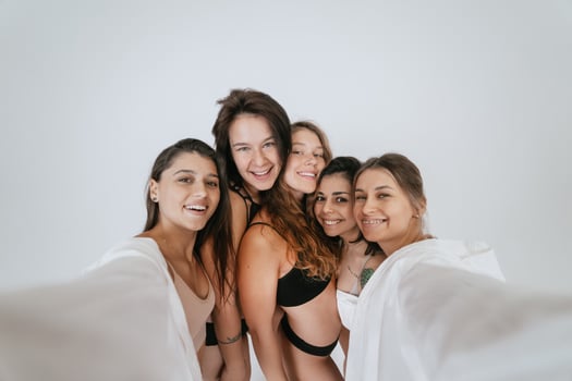 Diverse models wearing comfortable underwear take selfie photo