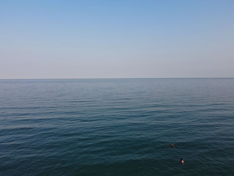 High Angle Footage and Aerial view of Ocean with High Speed Boats, People are having fun and enjoying hottest weather at Bournemouth Beach Sea Front of England UK. photo