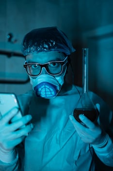 Young male researcher carrying out scientific experiment. photo