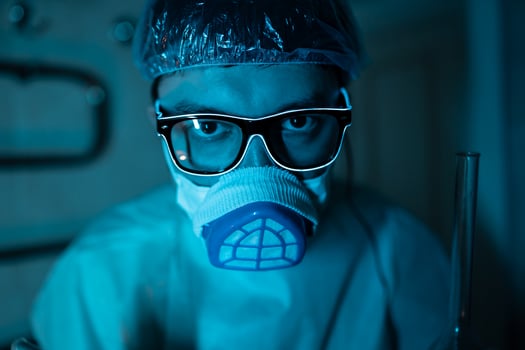 Young male researcher carrying out scientific experiment. photo