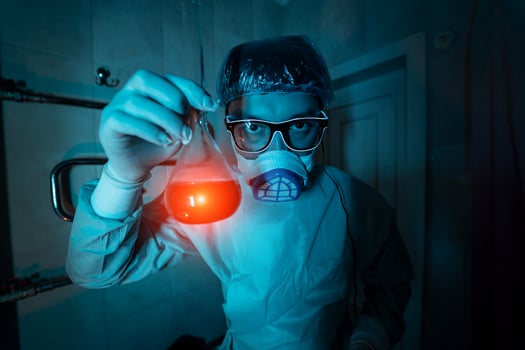 Young male researcher carrying out scientific experiment. photo