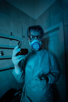 Young male researcher carrying out scientific experiment. photo