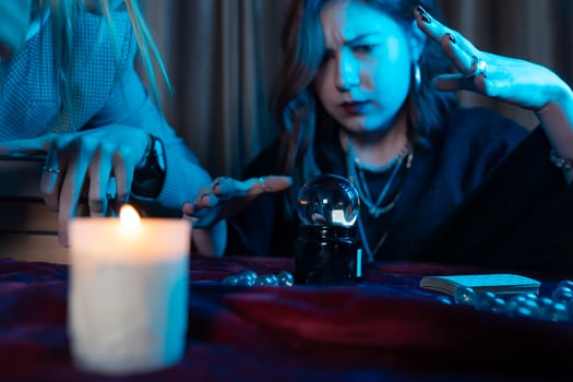 Woman and woman fortune teller with crystal ball photo