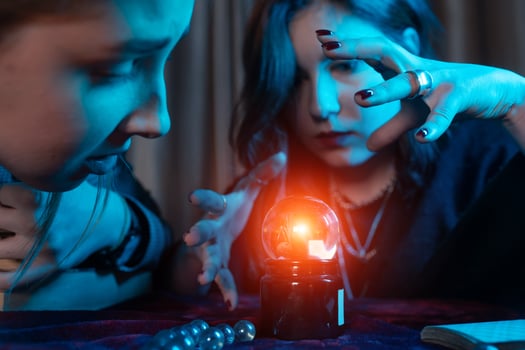 Woman and woman fortune teller with crystal ball photo