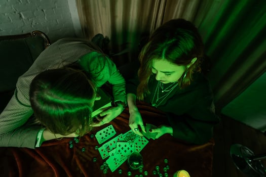 Fortune teller forecasting the future to woman with cards photo
