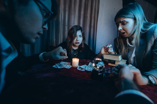 People hold hands of night at table with candles photo