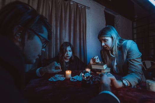 People hold hands of night at table with candles photo