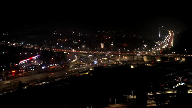 Aerial view of highway interchange at night, timelapse. photo